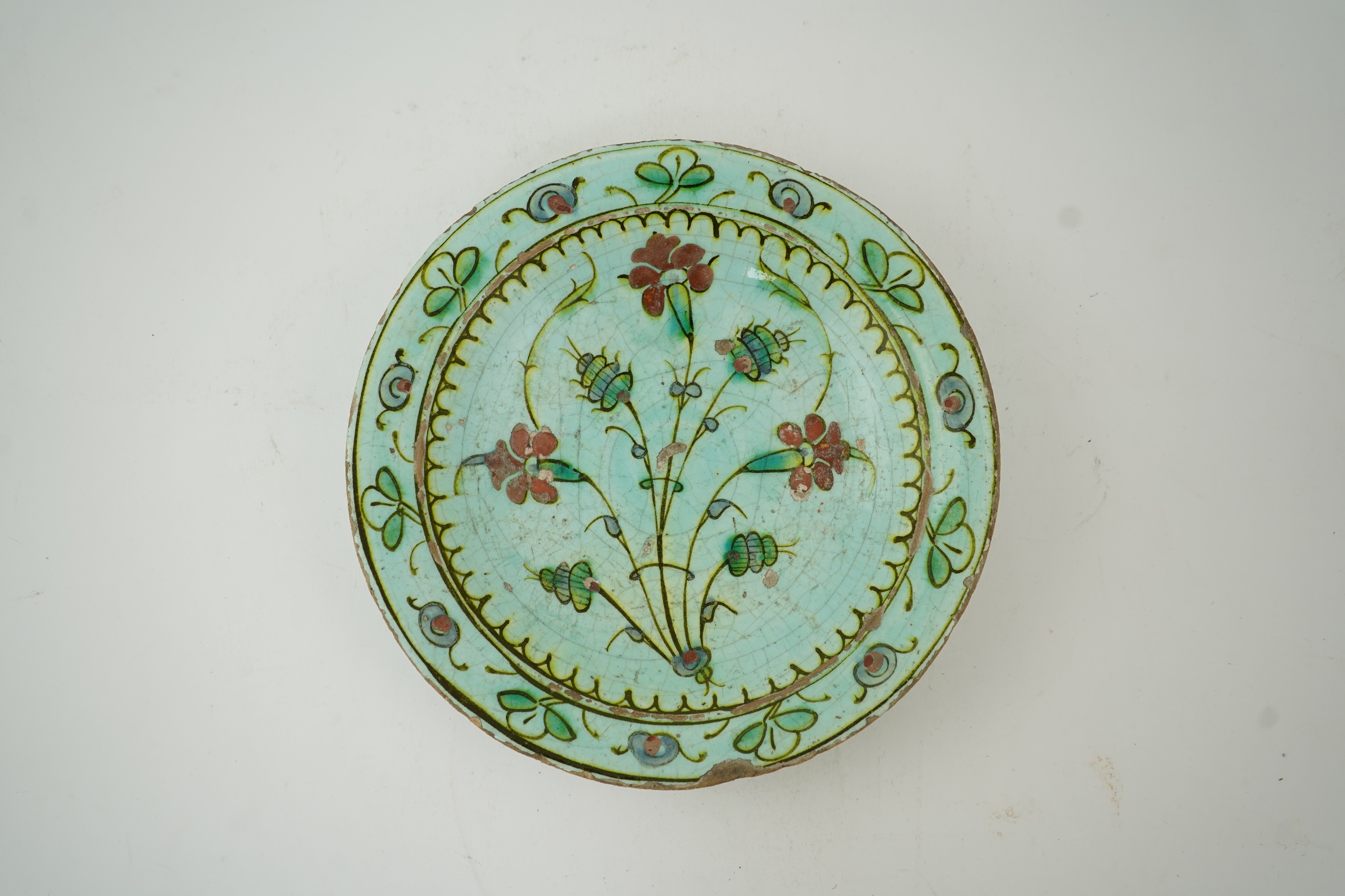 An Iznik pottery turquoise glazed dish, Ottoman Turkey, c.1650-1700